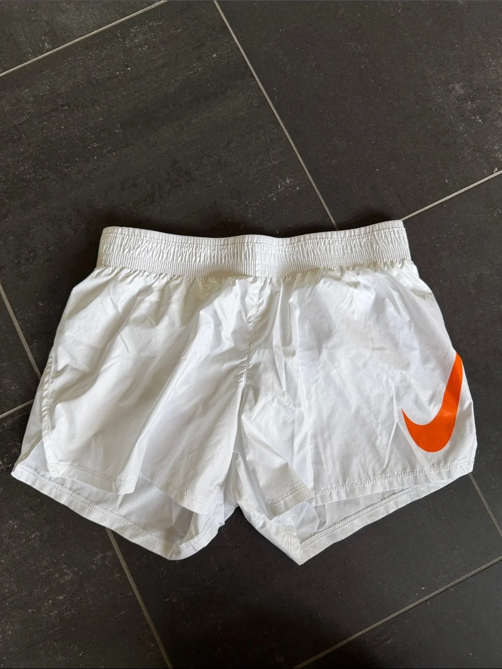 Nike Women’s White Athletic Shorts with Orange Swoosh size XS
